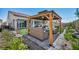 Cozy gazebo with outdoor seating and a view of the landscaped backyard at 6325 Gambetta St, Las Vegas, NV 89115