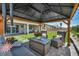 Gazebo with a stylish outdoor seating area overlooking the backyard and green space at 6325 Gambetta St, Las Vegas, NV 89115