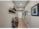 Inviting hallway featuring wood floors, stylish decor, and tasteful framed artwork creating a warm ambiance at 6325 Gambetta St, Las Vegas, NV 89115