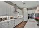 Modern kitchen with white cabinetry, subway tile backsplash, stainless steel appliances, and spacious countertops at 6325 Gambetta St, Las Vegas, NV 89115