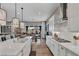 Spacious kitchen with white cabinetry, stainless steel appliances, a large island, and an open-concept layout at 6325 Gambetta St, Las Vegas, NV 89115