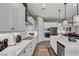 Contemporary kitchen showcasing sleek white countertops, stylish cabinetry, and modern stainless steel appliances at 6325 Gambetta St, Las Vegas, NV 89115