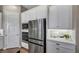 This kitchen showcases stainless steel appliances and white cabinetry for a bright and modern feel at 6325 Gambetta St, Las Vegas, NV 89115