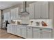 Updated kitchen features white cabinets, modern appliances, and a subway tile backsplash at 6325 Gambetta St, Las Vegas, NV 89115