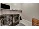 Well-equipped laundry room featuring modern LG washer and dryer units, providing convenience and efficiency at 6325 Gambetta St, Las Vegas, NV 89115