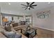 Inviting open-concept living room, seamlessly connects to the kitchen and dining area at 6325 Gambetta St, Las Vegas, NV 89115