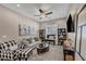 Cozy living room featuring neutral tones, comfortable seating, stylish decor, and plenty of natural light at 6325 Gambetta St, Las Vegas, NV 89115