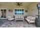 Inviting covered patio with comfortable seating, ceiling fan and gas heater for outdoor relaxation at 6325 Gambetta St, Las Vegas, NV 89115