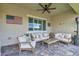 Relaxing covered patio with comfortable seating and stylish decor, perfect for outdoor lounging at 6325 Gambetta St, Las Vegas, NV 89115