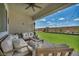 Beautiful covered patio with cozy seating, a heater, and an inviting view of the lawn at 6325 Gambetta St, Las Vegas, NV 89115