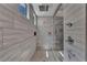 Large walk-in shower featuring stylish tiling and a modern shower head at 6325 Gambetta St, Las Vegas, NV 89115