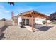 Charming covered patio area with gravel landscaping, perfect for outdoor relaxation and entertaining at 656 Thornewood Pl, Las Vegas, NV 89123