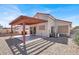 Cozy covered patio area with gravel landscaping, attached to the home for convenient outdoor access at 656 Thornewood Pl, Las Vegas, NV 89123