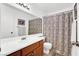 Bathroom with a single sink vanity and patterned shower curtain at 656 Thornewood Pl, Las Vegas, NV 89123