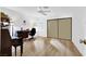 Spacious bedroom features laminate flooring, large closet, and bright windows at 656 Thornewood Pl, Las Vegas, NV 89123