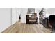 Bedroom featuring laminate floors, piano, desk and workspace at 656 Thornewood Pl, Las Vegas, NV 89123