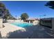 Beautiful community pool area with crystal-clear water, surrounded by lush greenery and mature trees at 656 Thornewood Pl, Las Vegas, NV 89123