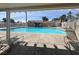 Spacious community pool with covered seating areas, providing a perfect spot for relaxation and recreation at 656 Thornewood Pl, Las Vegas, NV 89123
