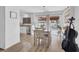 Dining area with sliding glass doors, modern light fixture, and stylish decor at 656 Thornewood Pl, Las Vegas, NV 89123