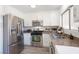 Well-lit kitchen featuring stainless steel appliances and granite countertops at 656 Thornewood Pl, Las Vegas, NV 89123