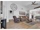 Bright living room with hardwood floors, modern decor, and an open layout at 656 Thornewood Pl, Las Vegas, NV 89123