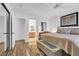 Bright main bedroom with en-suite bathroom, closet, and neutral decor at 656 Thornewood Pl, Las Vegas, NV 89123