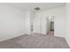 This bedroom has carpet, a doorway to a closet, and a doorway to a bathroom at 6743 Lotus Vista Ct, Las Vegas, NV 89156