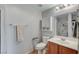 Bathroom featuring a single sink vanity and toilet with safety bars and a glass enclosed shower at 6868 Sky Pointe Dr # 1089, Las Vegas, NV 89131