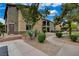 Apartment complex featuring sidewalks, gravel landscaping, and desert flora at 6868 Sky Pointe Dr # 1089, Las Vegas, NV 89131