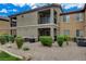 The exterior of the condo features a balcony, neutral colors, and well-maintained landscaping at 6868 Sky Pointe Dr # 1089, Las Vegas, NV 89131