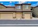 Street view of condo garages, neutral paint and stone accents at 6868 Sky Pointe Dr # 1089, Las Vegas, NV 89131