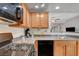 Modern kitchen with stainless steel appliances, gas range, and convenient breakfast bar at 6868 Sky Pointe Dr # 1089, Las Vegas, NV 89131
