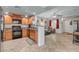 Open concept kitchen with light wood cabinets, stainless appliances, and breakfast bar at 6868 Sky Pointe Dr # 1089, Las Vegas, NV 89131