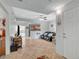Open-concept living room featuring tile flooring, ceiling fan, and access to the kitchen at 6868 Sky Pointe Dr # 1089, Las Vegas, NV 89131
