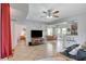 Spacious living room with tile floors, view of kitchen, and access to outdoor dining area at 6868 Sky Pointe Dr # 1089, Las Vegas, NV 89131
