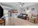 Bright living room with tile floors, comfortable seating, and view of the kitchen at 6868 Sky Pointe Dr # 1089, Las Vegas, NV 89131