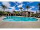 Beautiful pool area with clear water, surrounded by palm trees and lounge chairs for relaxation at 6868 Sky Pointe Dr # 1089, Las Vegas, NV 89131