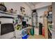 A cluttered utility room with storage shelves and a water heater at 6868 Sky Pointe Dr # 1089, Las Vegas, NV 89131