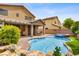 Backyard with pool, spa, covered patio, and low-maintenance landscaping at 7013 Bisoni St, Las Vegas, NV 89149