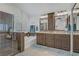 Bathroom features dual vanity, soaking tub, glass shower, and tiled floors at 7013 Bisoni St, Las Vegas, NV 89149