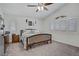 Bedroom with ceiling fan, vaulted ceiling, and shuttered windows at 7013 Bisoni St, Las Vegas, NV 89149