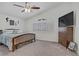 Bedroom with ceiling fan, vaulted ceiling, and shuttered windows at 7013 Bisoni St, Las Vegas, NV 89149