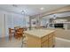 Eat-in kitchen features a breakfast bar and bright light through the window at 7013 Bisoni St, Las Vegas, NV 89149