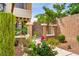Charming front yard with garden pathway and beautiful colorful landscaping adding curb appeal to the lovely home at 7013 Bisoni St, Las Vegas, NV 89149