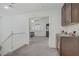 Upstairs hallway offering an open view into a bedroom with bright natural light and neutral tones at 7013 Bisoni St, Las Vegas, NV 89149