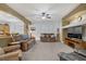 Spacious living room featuring neutral paint, carpet, ceiling fan, and comfortable furniture at 7013 Bisoni St, Las Vegas, NV 89149