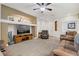 Comfortable living room features a large television and neutral finishes at 7013 Bisoni St, Las Vegas, NV 89149