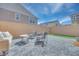 Paver patio with seating and grill, great for outdoor relaxation and entertaining in backyard at 764 Aurora Vale Pl, Henderson, NV 89011