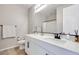 Modern bathroom featuring a sleek vanity, toilet, and contemporary fixtures at 764 Aurora Vale Pl, Henderson, NV 89011