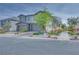 Charming two-story home with desert landscaping, brick accents, and a three-car garage at 764 Aurora Vale Pl, Henderson, NV 89011